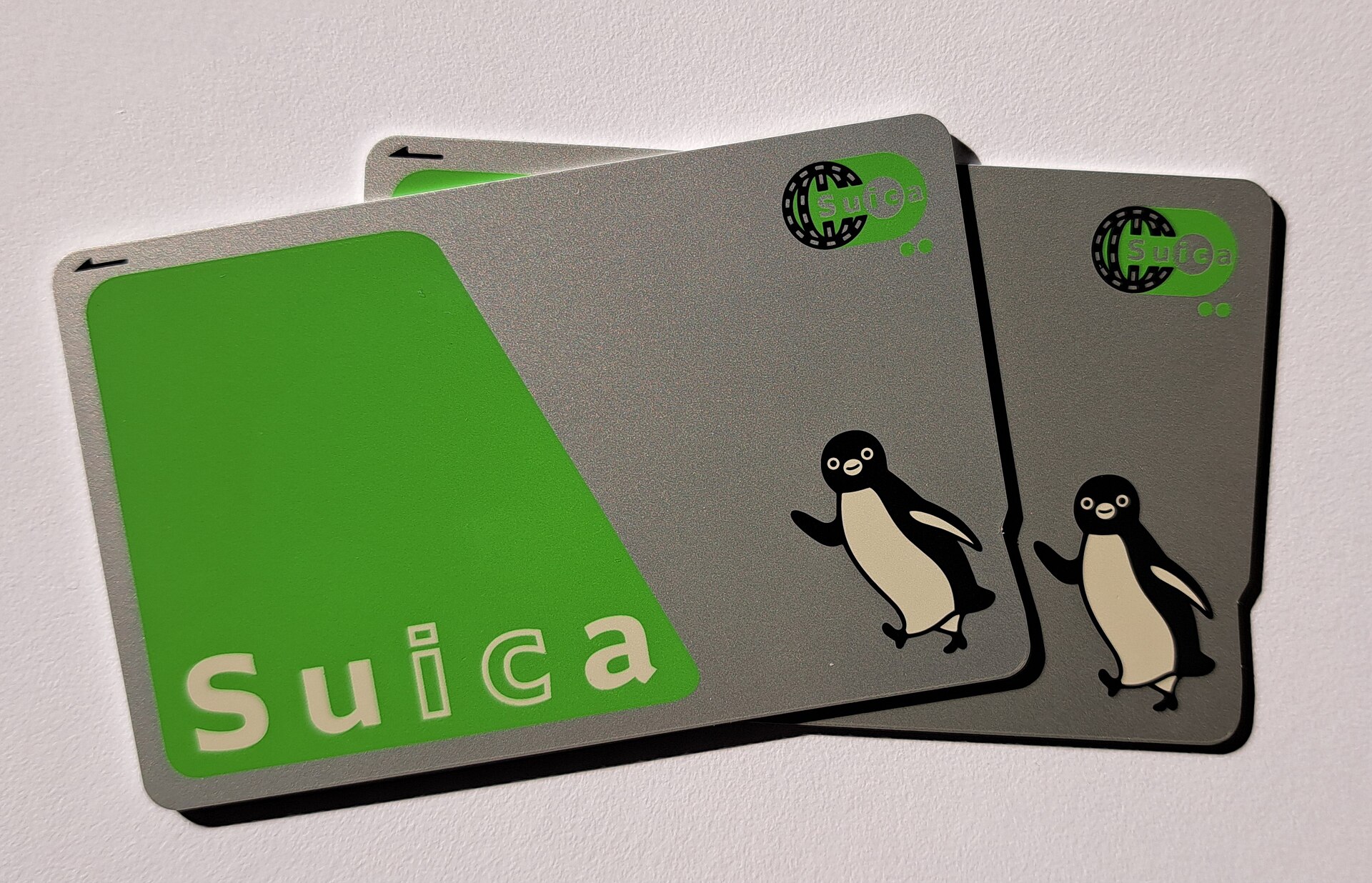 Suica cards fanned out on a plain surface